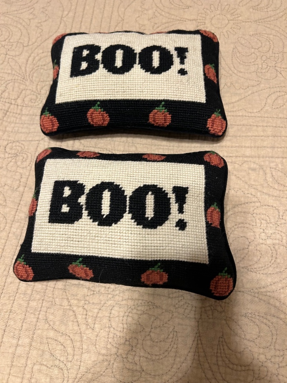 2 Cross stitch Boo pillows with pumpkins.